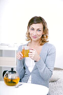 Woman drinking herbal tea.