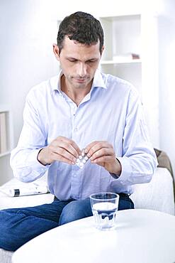 Man taking medicine.