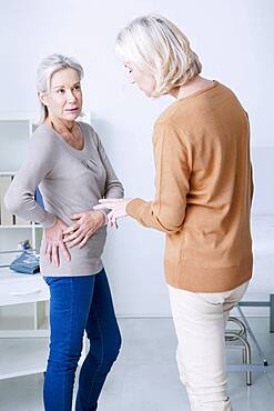 Female patient consulting for hip pain.