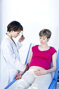 Blood sample being taken from pregnant woman.