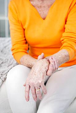 Senior woman with wrist pain.