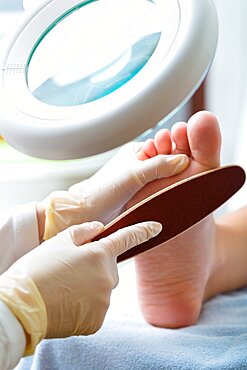 Woman receiving podiatry treatment in a Day Spa.