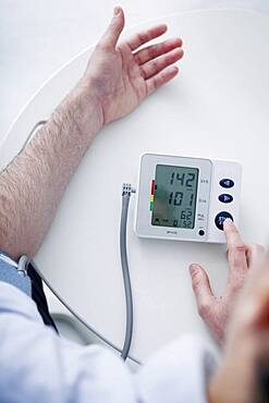 Man measuring his blood pressure.