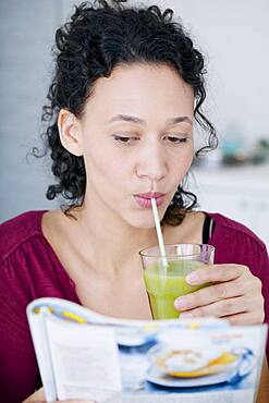 Woman drinking smoothie.