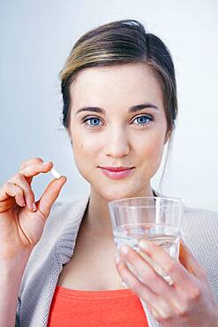 Woman taking medication