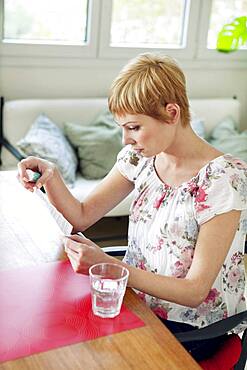 Woman taking medication