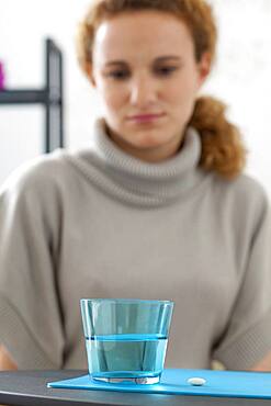 Woman taking medication
