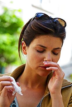 Woman sneezing