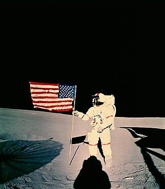 Astronaut with US flag on moon