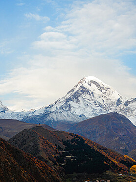 Sunrise view of Gergeti Trinity Church and Mount Kazbek, Kazbegi, Georgia (Sakartvelo), Central Asia, Asia