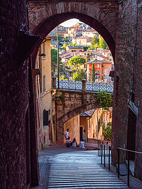 Perugia's Aqueduct street with its famous bridge as seen from an alley, Perugia, Umbria, Italy, Europe