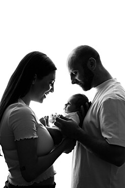 Parents with a baby, studio shot, United Kingdom, Europe