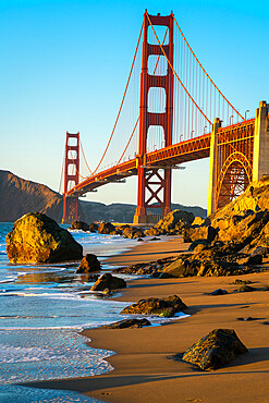 Golden Gate bridge seen from Marshall beach at sunset, San Francisco, California, USA