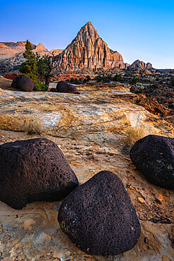 Lava stones and Pectol's Pyramid at dusk, Capitol Reef National Park, Utah, Western United States, USA