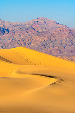 Mesquite Flat Sand Dunes and rocky mountains in desert, Death Valley National Park, California, USA