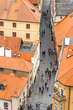 High angle view of street with tourists amongst houses in historical center of Cesky Krumlov, UNESCO World Heritage Site, Cesky Krumlov, Czech Republic (Czechia), Europe