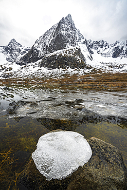 Ice formation on top of a rock in the Arctic landscape, Flakstadoya, Nordland, Lofoten Islands, Norway, Scandinavia, Europe