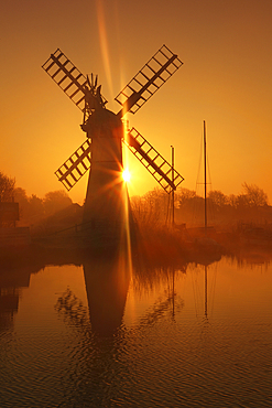 Winter sunrise over Thurne Mill, Norfolk Broads, Norfolk, England, United Kingdom, Europe