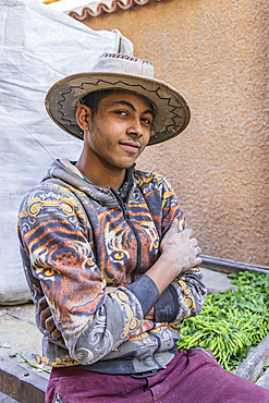 Old Cairo, Cairo, Egypt. February 11, 2022. A young man delivering vegetables in Old Cairo.