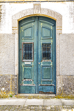 Europe, Portugal, Caminha. Porto. A green painted wooden door in Caminha.