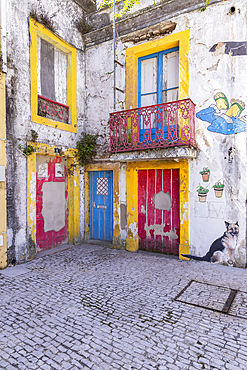 Europe, Portugal, Alcobaca. April 14, 2022. Colorful artwork on buildings in Alcobaca.