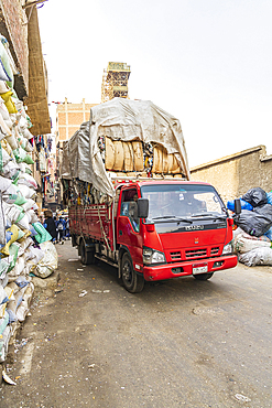 Manshiyat Naser, Garbage City, Cairo, Egypt. February 21, 2022. Truck loaded with garbage in Manshiyat Naser, Garbage City.