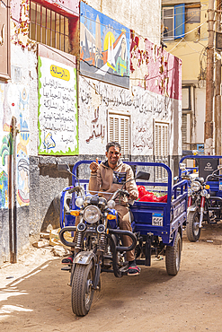 Thebes, Luxor, Egypt. February 24, 2022. A motorcycle delivery cart in a market in Luxor.