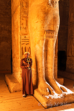 Abu Simbel, Aswan, Egypt. February 23, 2022. Caretaker holding a large key in the shape of an Ankh in the Great Temple of Ramesses II.