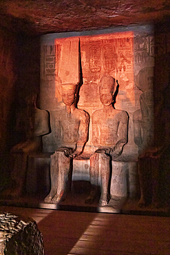 Abu Simbel, Aswan, Egypt. February 23, 2022. Sunrise light on statues of Ptah, Amun, Ramesses II, and Ra in the Holiest of Holies in the Great Temple of Ramesses II.