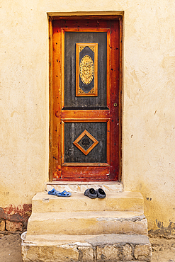 Faiyum, Egypt. A wooden door on a building in the village of Faiyum.