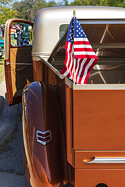 Marble Falls, Texas, USA. April 10, 2021. US flag in a vintage pickup truck.