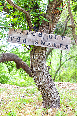 Castroville, Texas, USA. April 12, 2021. Sign warning snakes in the Texas hill country.