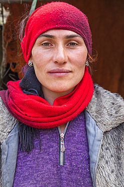 Gorno-Badakhshan Autonomous Province, Tajikistan. August 14, 2021. A woman wearing a red head scarf in the mountains of Tajikistan. Editorial Use Only