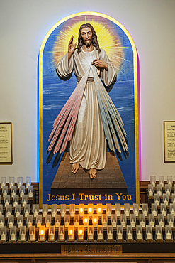 Chinatown, Manhattan, New York City, New York, USA. November 3, 2021. Candles at an alter in a church in Chinatown.