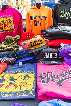 Harlem, Manhattan, New York City, New York, USA. November 4, 2021. Souvenir caps and shirts for sale in Harlem.