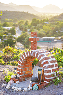 Mulege, Baja California Sur, Mexico. A small brick roadside shrine near Mulege in Baja.