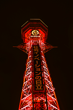 Osaka Tsutenkaku tower in the Shinsekai district. Illuminated red night lights. Japan