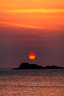 Colorful Sunset Behind the Silhouette of Fort National Seen from the Shoreline of Saint-Malo in Brittany France
