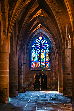 Gothic stone arches and stained glass windows inside Basilique Saint-Sauveur Dinan Brittany France Basilique Saint-Sauveur