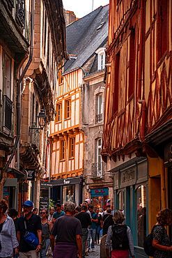 View along a narrow alley of half timbered houses in old town of Vannes, Britanny, France