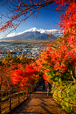 View over the city of Fujiyoshida, Mount Fuji and maples leaves in autumn, Fujiyoshida, Honshu, Japan, Asia