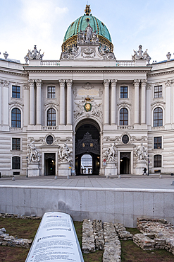 Vienna, Austria - View of Michaelerplatz, the historic square in front of Hofburg Palace's Michaelertor gate, featuring the excavated ruins of ancient Roman and medieval Vienna alongside Baroque architecture.