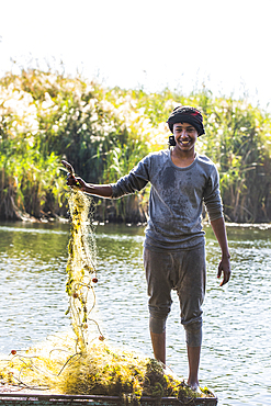 Net fisherman in rowing boat, village of Ramadi, west bank of the Nile south of Edfu, Egypt, North Africa, Africa