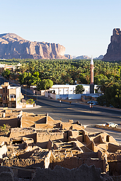 Old mudbrick village under reconstruction with date pelm groves in the background, Old town of AlUla, Medina Province, Saudi Arabia, Middle East