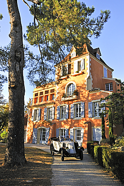 Open touring vintage car (Renault 1925) at the Charming private castle Les Charmettes. Auch.Gers department, Occitanie region, southwest of France,Europe