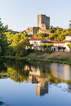 Tower of the former Castle of Luzech is reflected in the Lot River, Lot department, region of Midi-Pyrenees, southwest of France, Europe