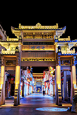 Paifang Street at night. These memorial arches (Paifang) are arches built to commend and commemorate celebrities and sages since 3000 years ago. The arches in Paifang Street were built between 1517 - 1785. Chaozhou, Guangdong Province, China