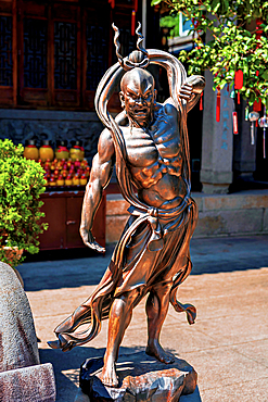 Bronze sculpture of a heavenly warrior in Dingguang Temple, aka White Pagoda Temple (first established 905 AD, rebuilt between 1821-1850). Fuzhou, Fujian Province, China.