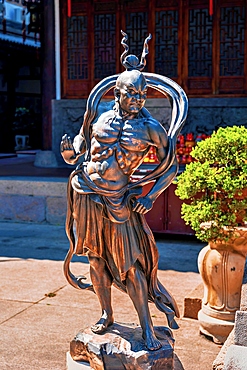 Bronze sculpture of a heavenly warrior in Dingguang Temple, aka White Pagoda Temple (first established 905 AD, rebuilt between 1821-1850). Fuzhou, Fujian Province, China.