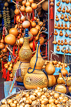 Hulus (gourd) in a shop at TunXi Ancient Street. Huangshan City, Anhui Province, China. Hulus are associated with good fortune, longevity and health, it is believed to ward off evil spirits. It is usually used to contain fluids.